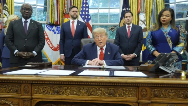 President Donald Trump with Congo's Foreign Minister Therese Kayikwamba Wagner and Rwanda's Foreign Minister Olivier Nduhungirehe at the White House in June, as Vice President JD Vance and Secretary of State Marco Rubio watch. | Manuel Balce Ceneta/AP