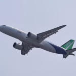 A COMAC C919 narrowbody airliner flies in the sky at the China International Aviation and Aerospace Exhibition, or Airshow China, in Zhuhai, Guangdong province, China November 12, 2024.