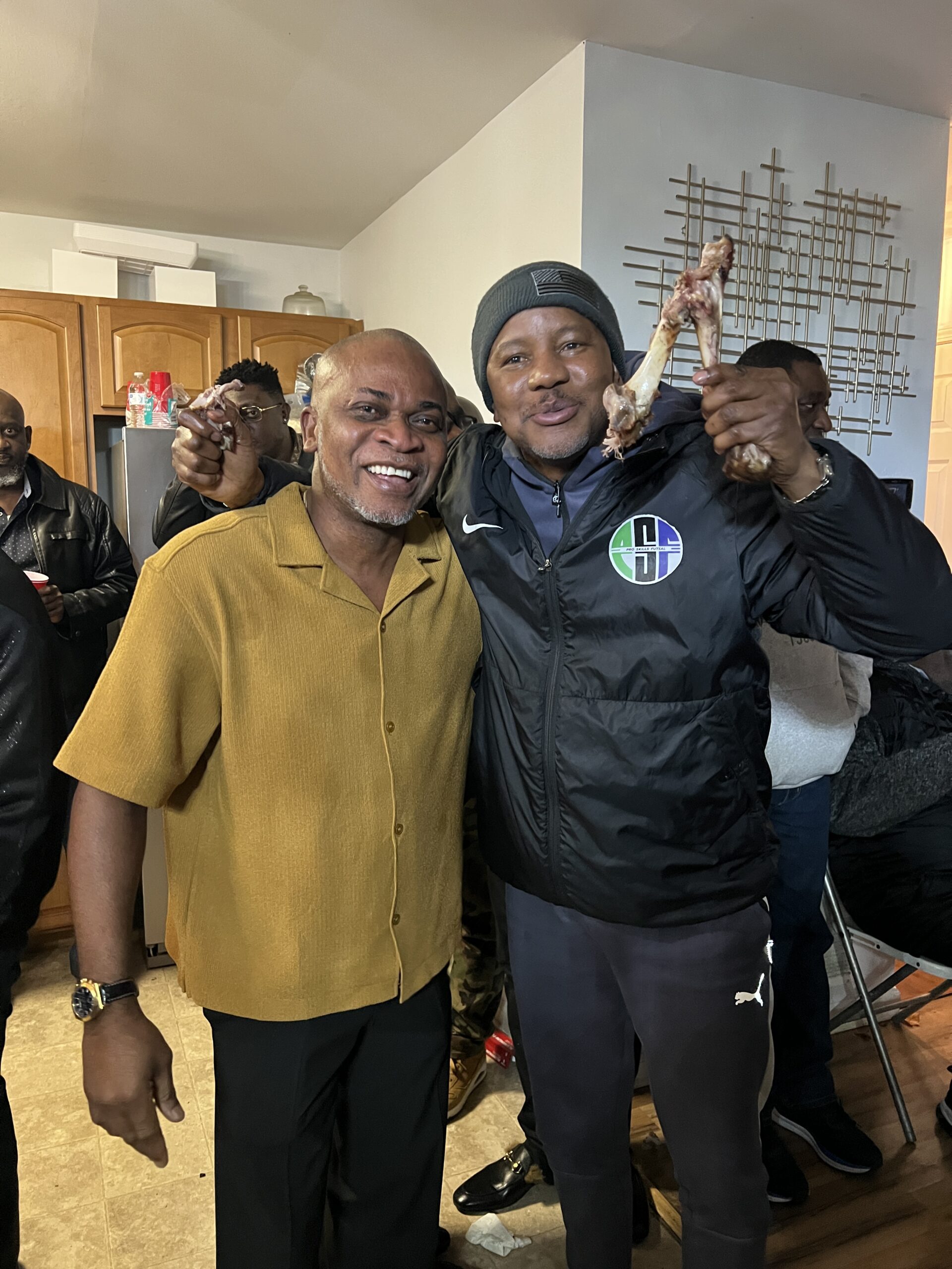 Quam Dickson-Olaogun hoisted a large piece of roasted meat, posed with Lawrence Bassey at Awwal Ayinde birthday party