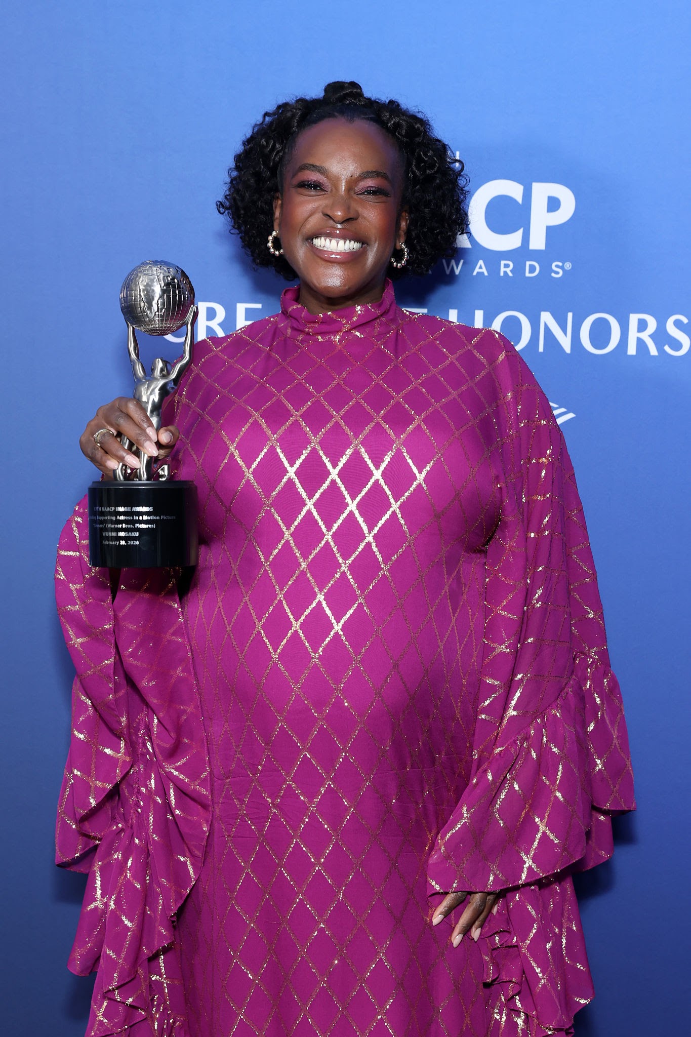 LOS ANGELES, CALIFORNIA - FEBRUARY 26: Wunmi Mosaku poses with the Outstanding Supporting Actress in a Motion Picture award for "Sinners" during the NAACP Image Awards Creative Honors at L.A. Live Event Deck Top Floor Of The West Lot on February 26, 2026 in Los Angeles, California. (Photo by Leon Bennett/Getty Images for NAACP)