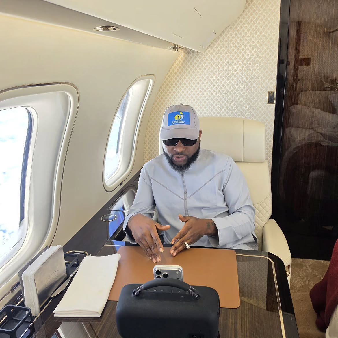 Davido touches down in Lagos, hosts Carter Efe, Kolu inside his private jet