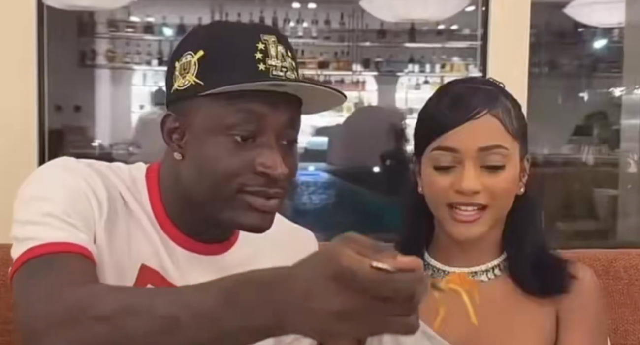 Carter Efe and Taylor Jasmine feed each other at a romantic dinner in Lagos